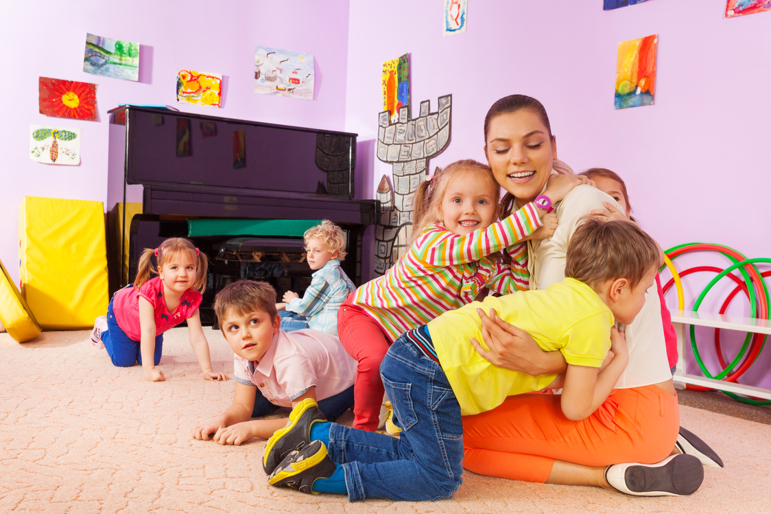 Kids Boys and Girls Hug Teacher